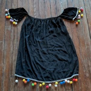 The cutest little black dress with Pom Pom details